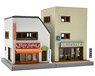 The Building Collection 106-3 Store in front of a station A3 (Model Train)