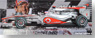ボーダフォン マクラーレン メルセデス MP4-25 Ｊ.バトン 2010 オーストラリアGP優勝（限定）スペシャルデザインプリント&ハイカバーパッケージ (ミニカー)